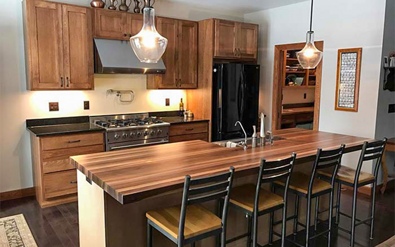 Kitchen island with seating and pendant lighting in Irvine renovation